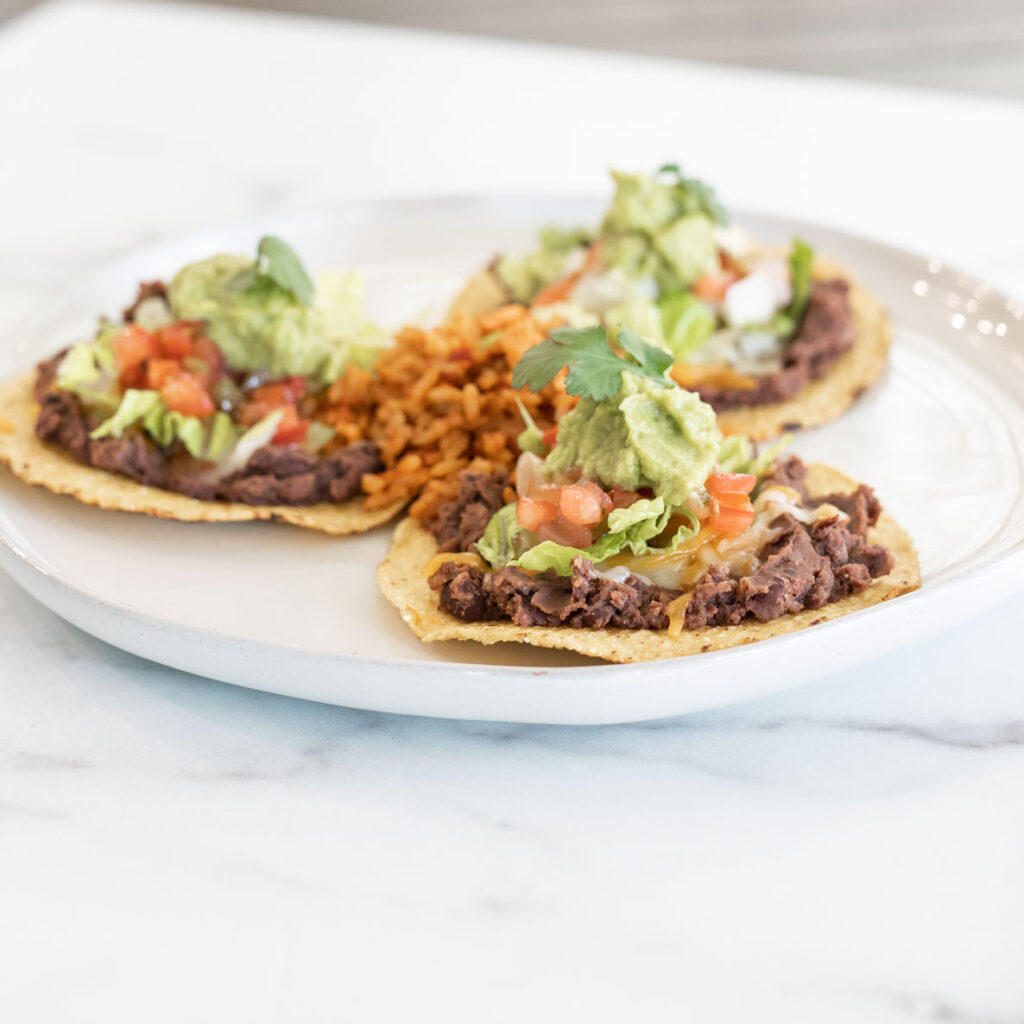 Side view of tostada on on a white plate