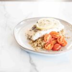 Tomatoes, cod and lemons over a bed of grains