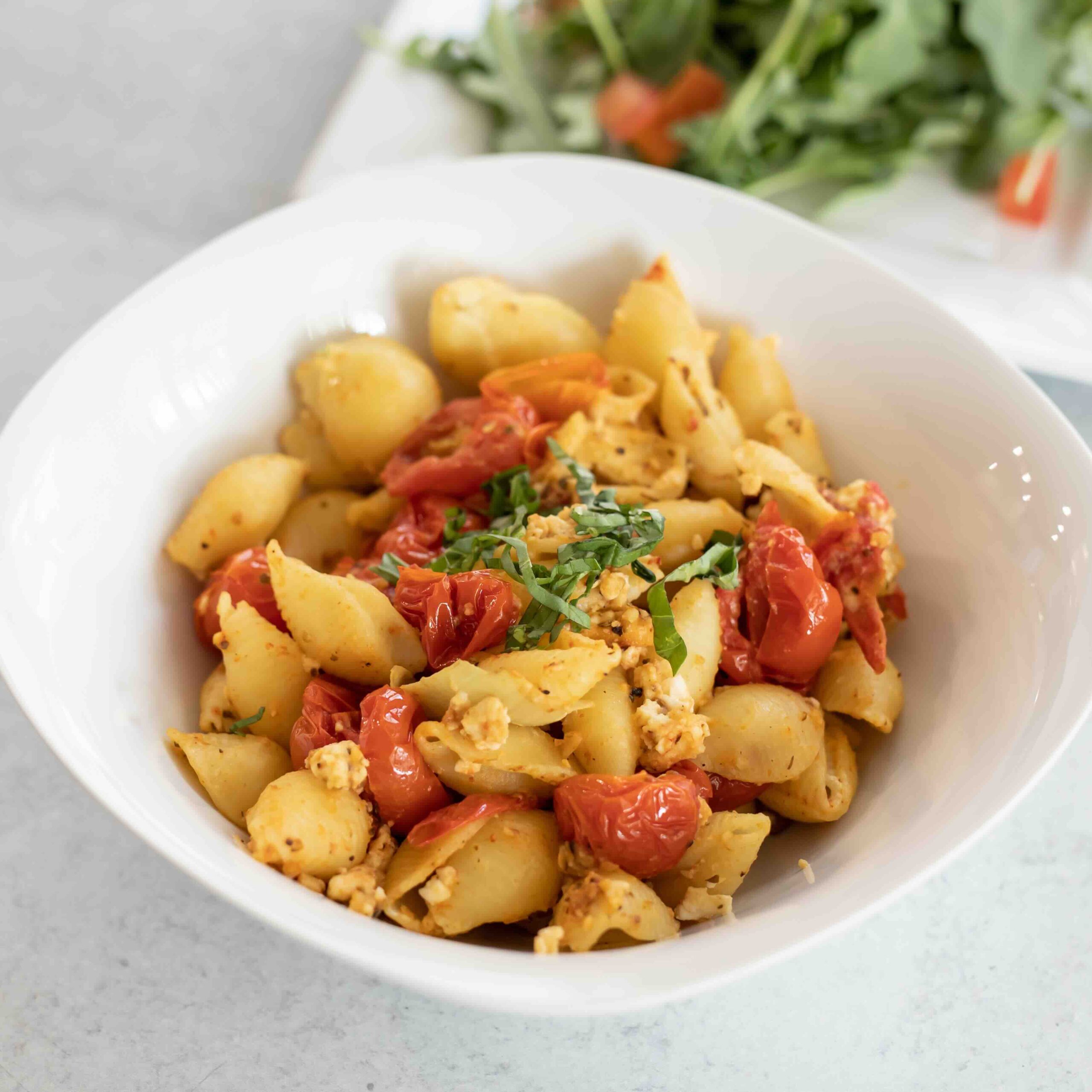 Viral Pasta dish with tomatoes noodles and a salad